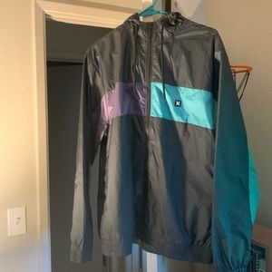 Grid patterned Hurley windbreaker with purple and cyan stripes in good condition